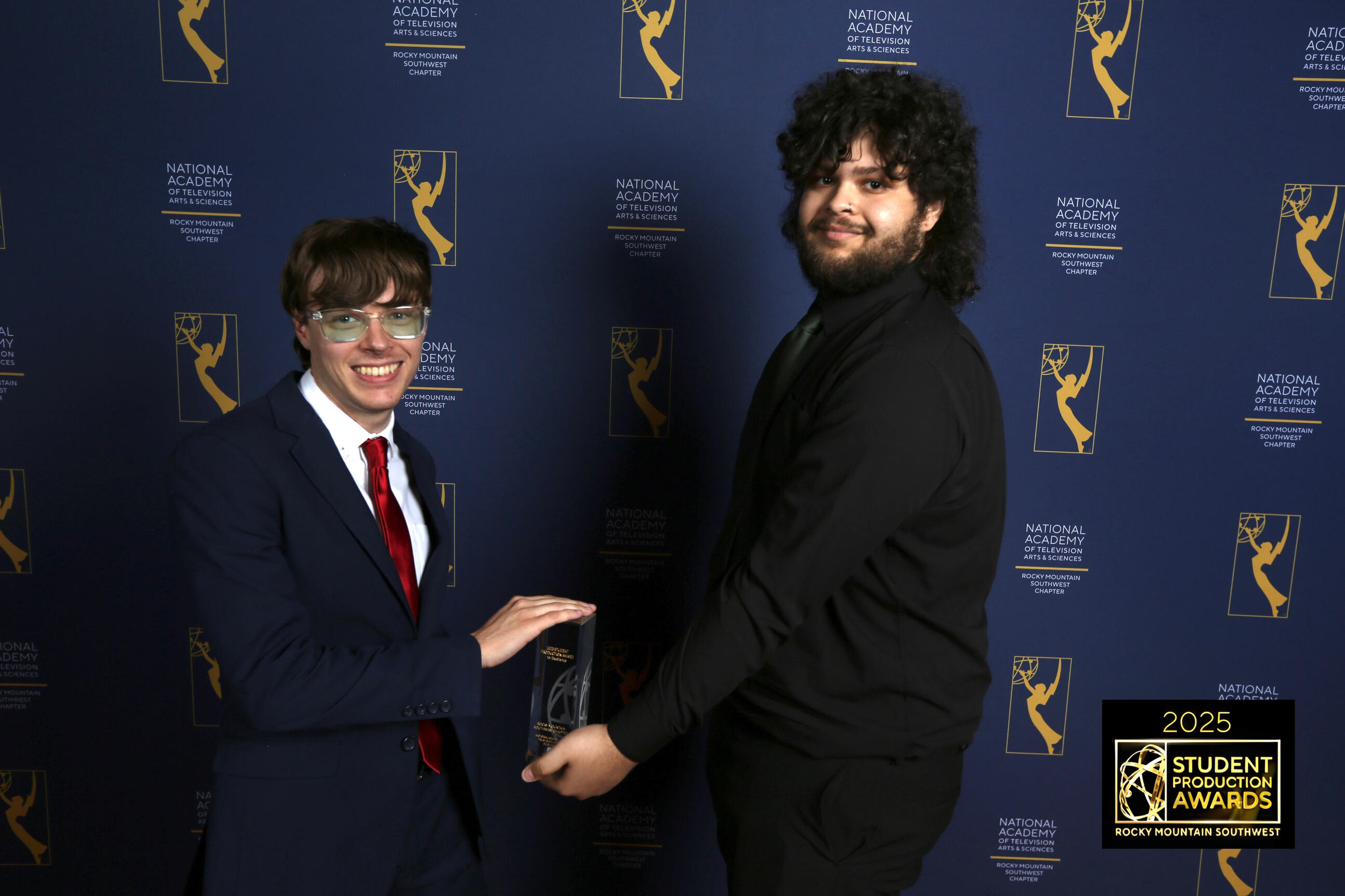 Brady and Xander accepting their Emmy